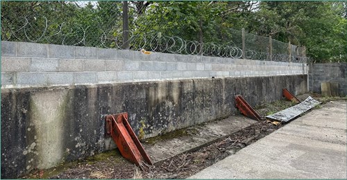 Image of unpermitted block stone wall constructed on top of NRW’s flood wall along the River Tawe